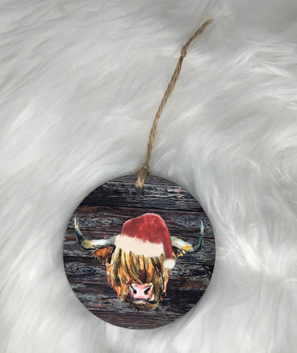 Cow with Santa Hat (R49) Round Ornament